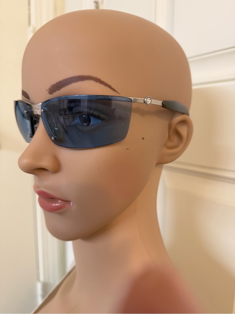 Women’s Vintage Chanel 4008 semi-rimless sport sunglasses.